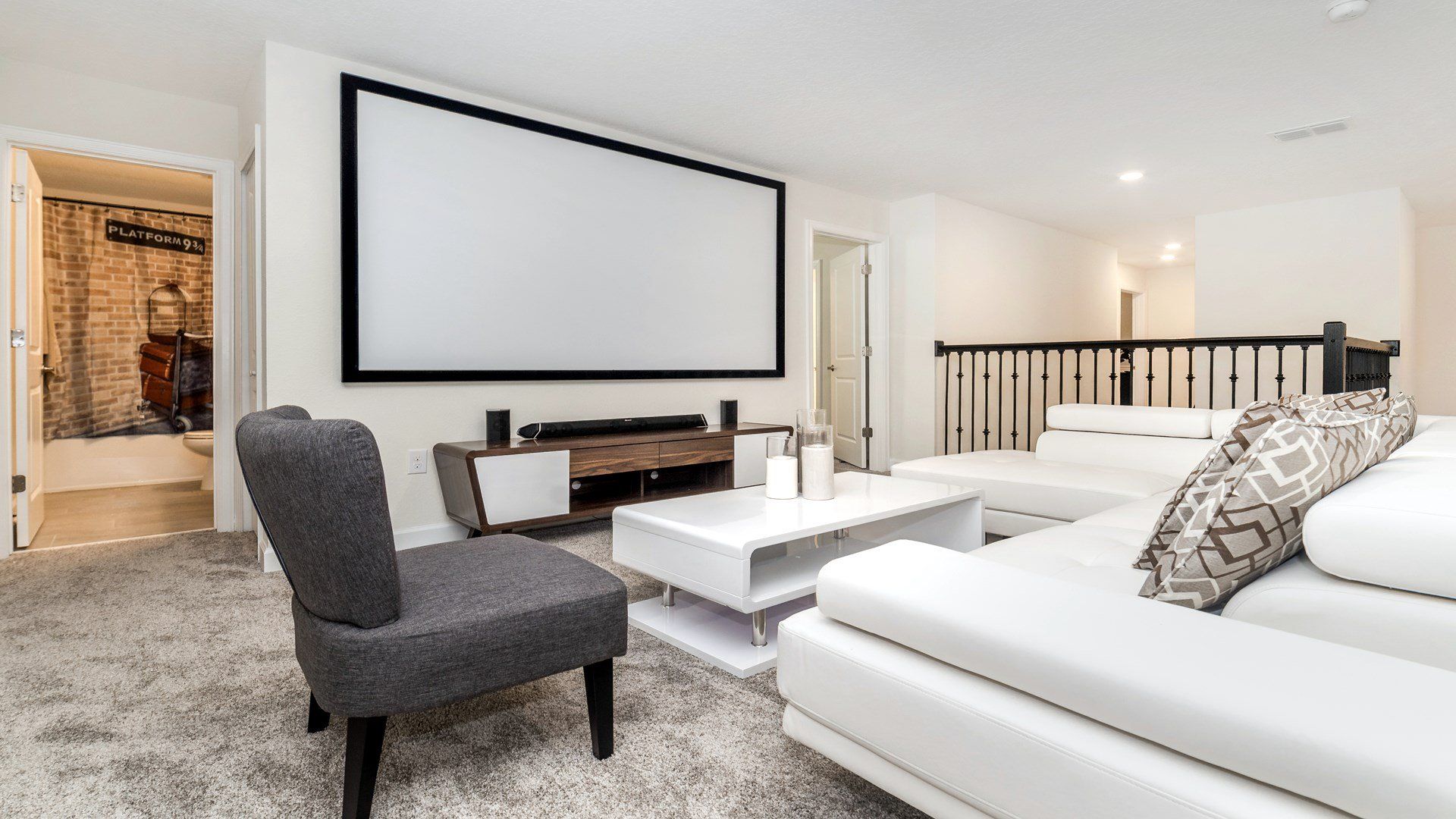 Cozy loft with a large projector screen, perfect for movie nights!