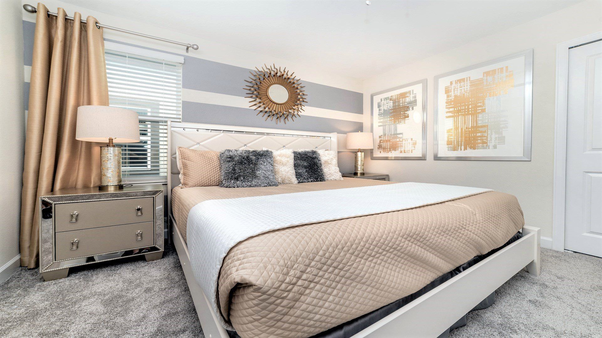 Luxurious bedroom with plush bedding, chic decor, and warm vibes!