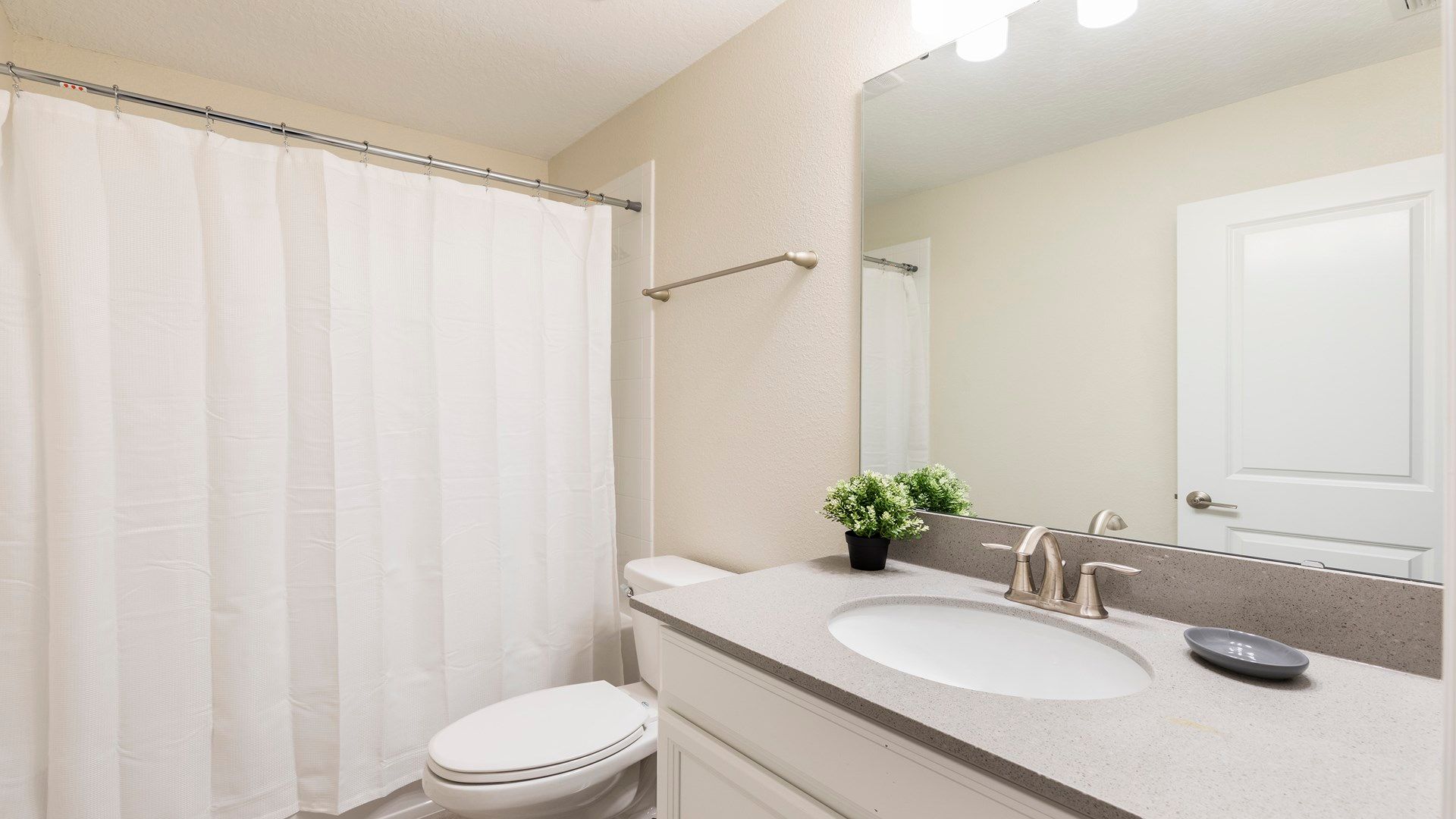 Bright and clean bathroom with modern fixtures and cozy ambiance!