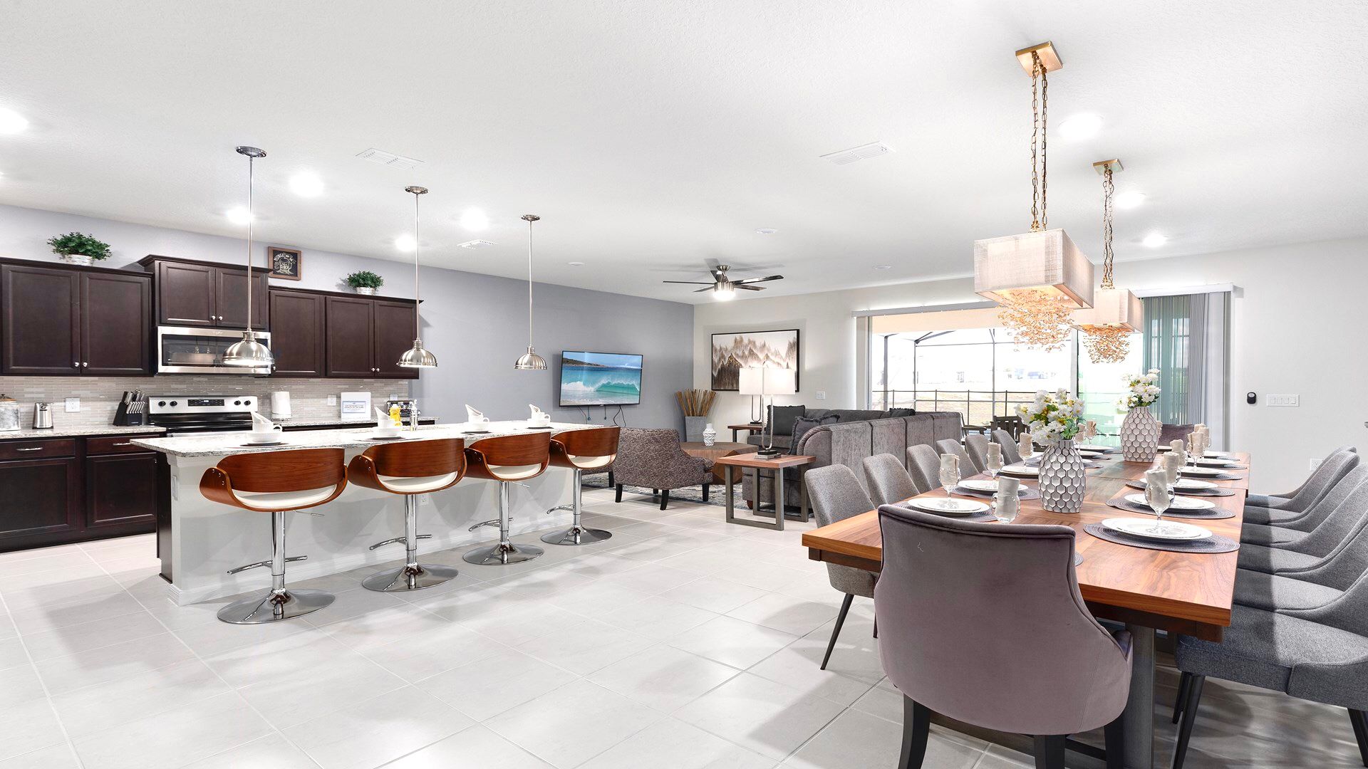 Open-concept kitchen and dining area with modern decor and ample seating.