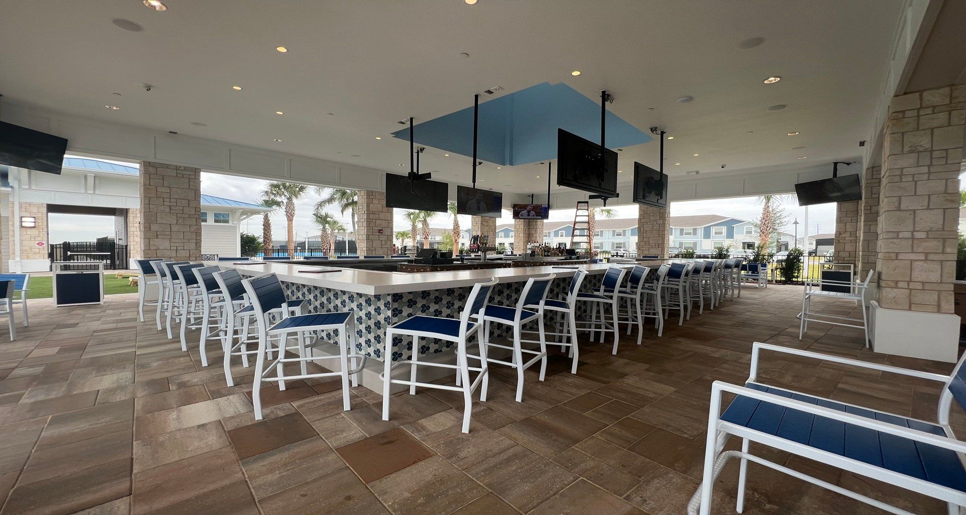 Relax and unwind at this open-air poolside bar with sleek seating and scenic views.