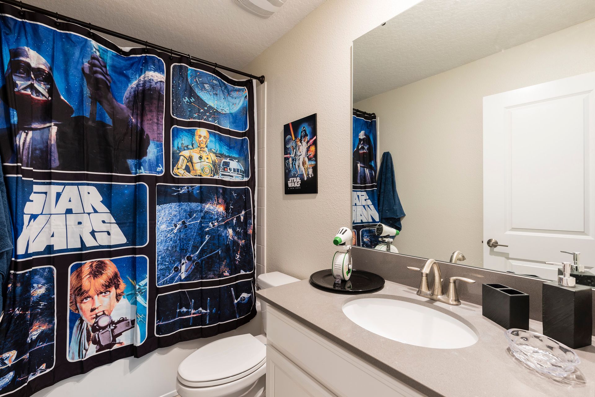 Star Wars-themed bathroom with bold decor, sleek fixtures, and galactic flair.