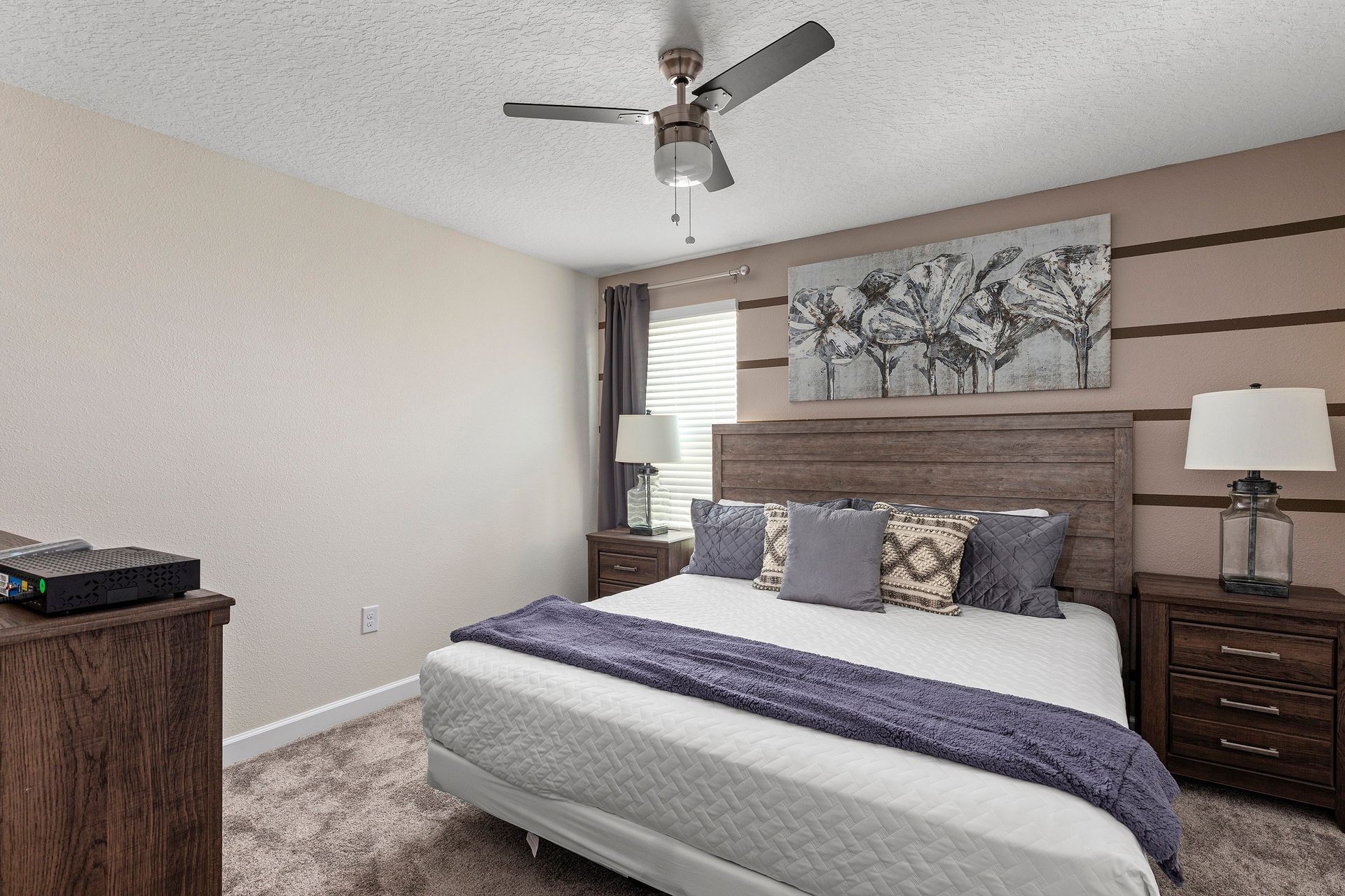 Cozy bedroom with rustic wood accents, soft linens, and warm, neutral tones.