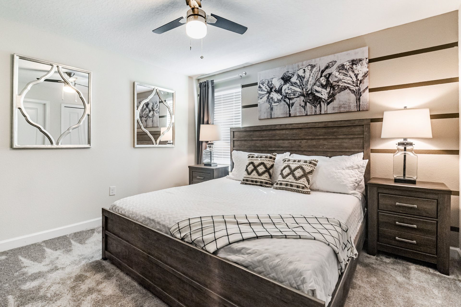 Charming bedroom with rustic accents, mirrored decor, and cozy neutral tones.