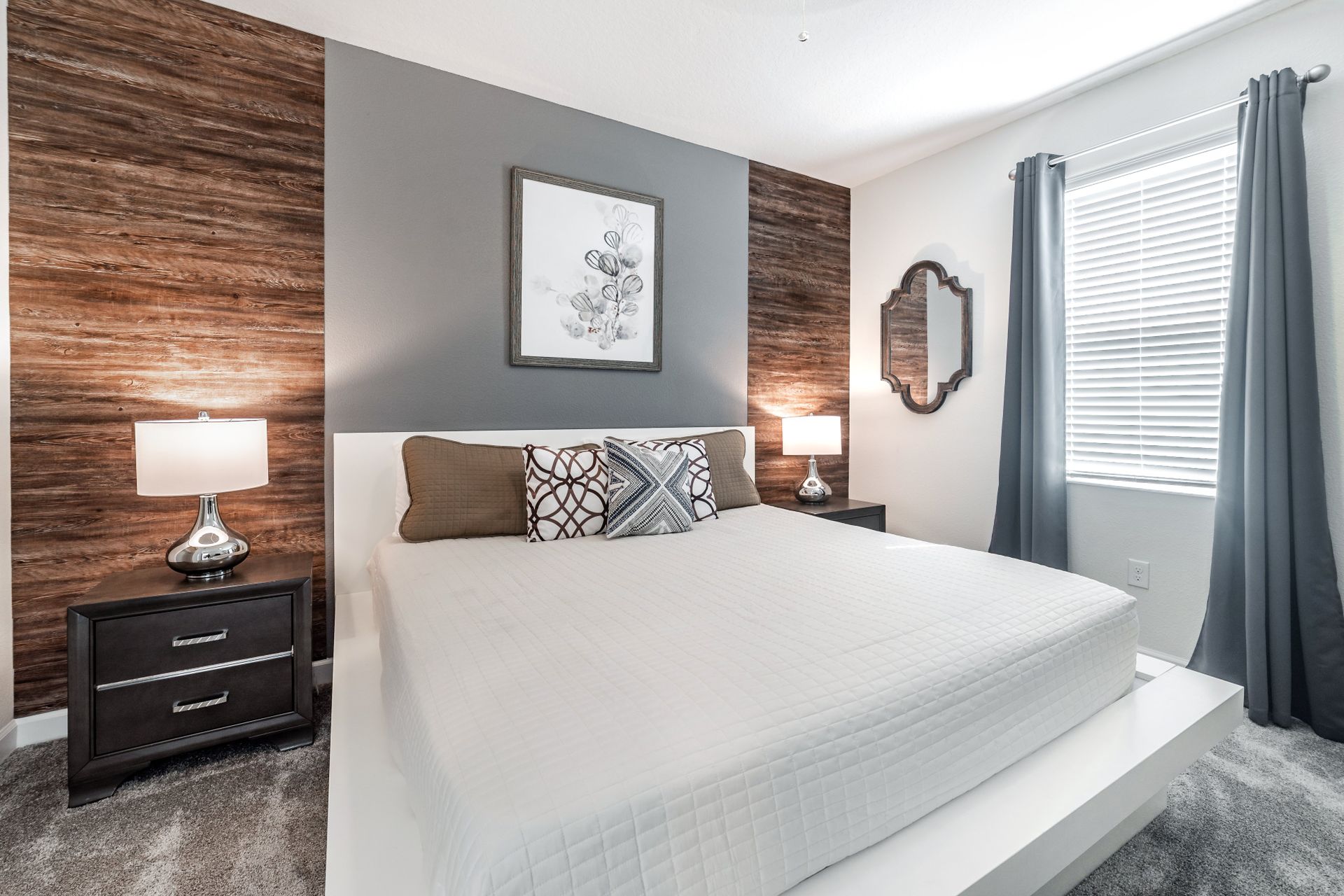 Modern bedroom with wood accents, soft lighting, and a sleek, minimalist design.