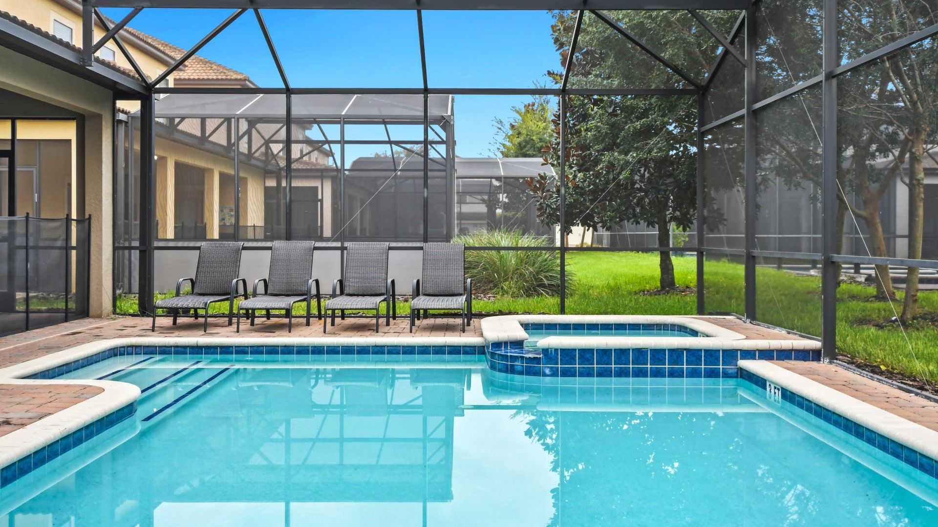 Screened-in spa and pool area, offering a private retreat