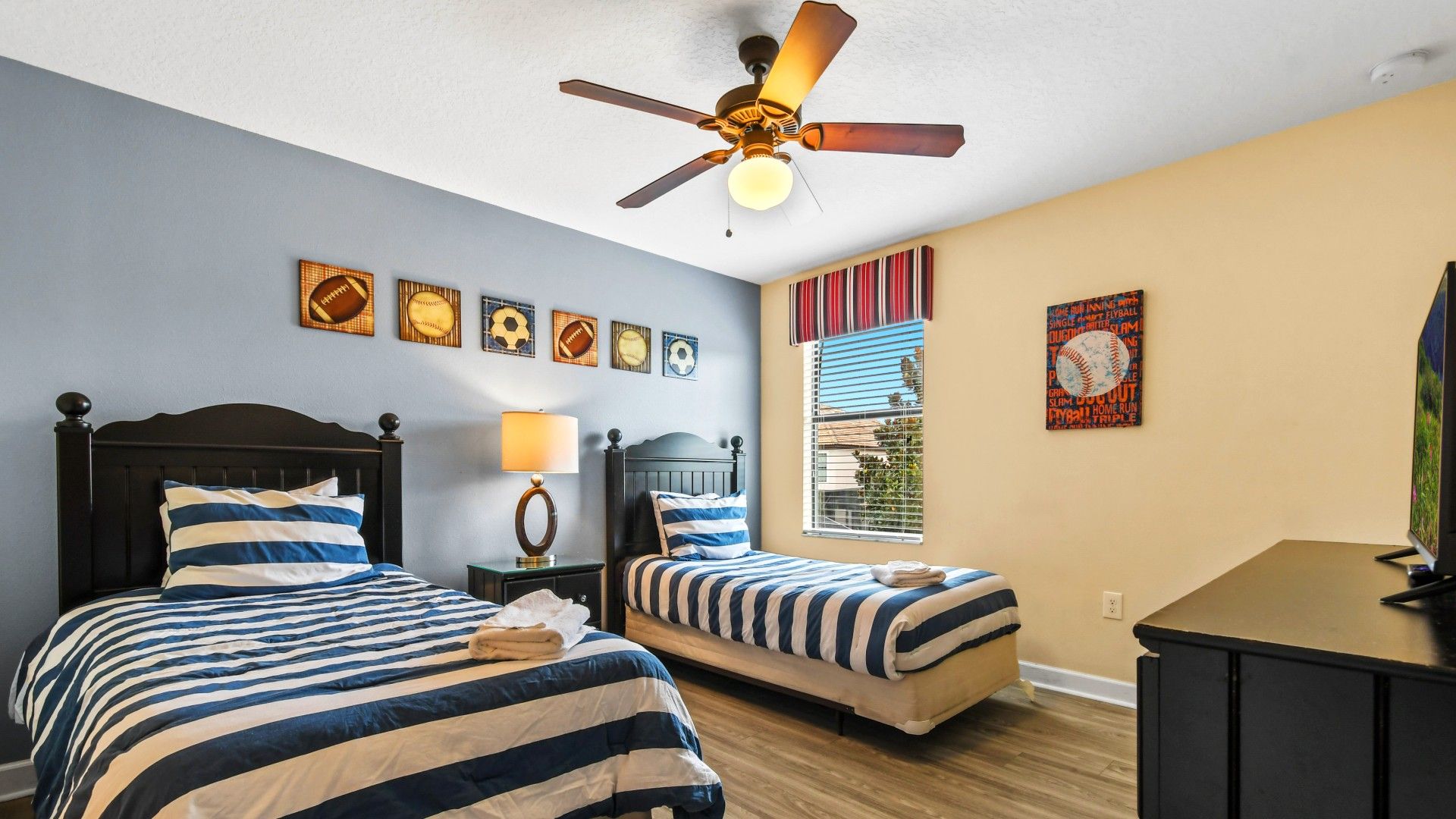 Well-appointed bedroom featuring double bed and one single bed