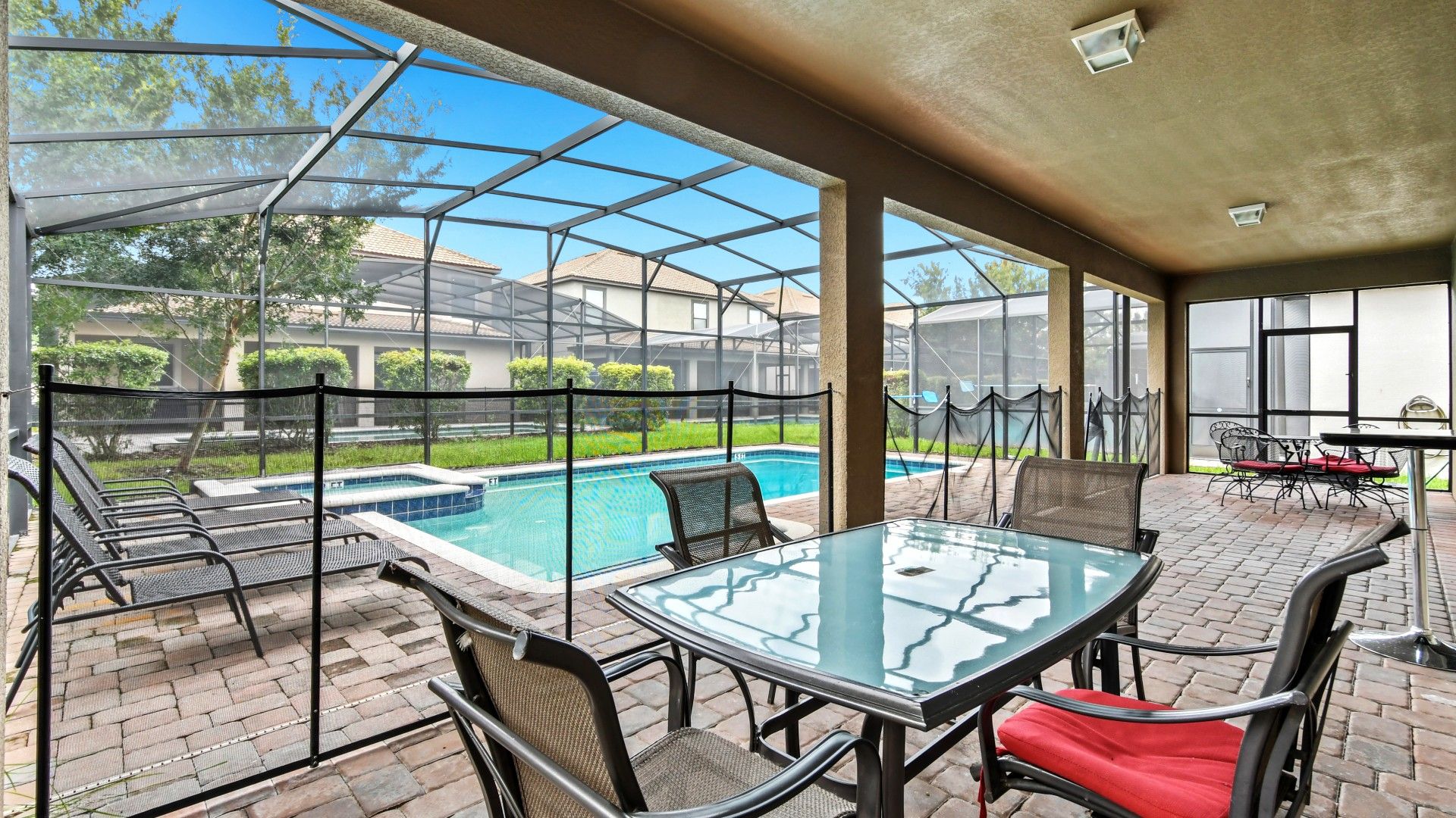Screened-in spa and pool area, offering a private retreat