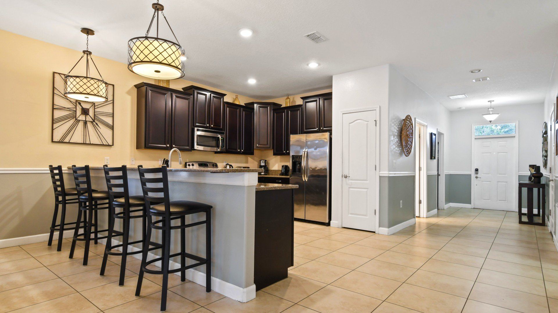 Modern kitchen seamlessly integrated with a sleek mini bar
