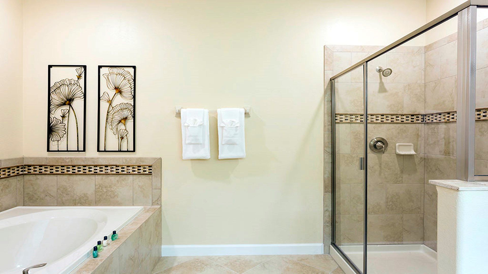 A full bathroom, complete with modern fixtures, a spacious vanity.