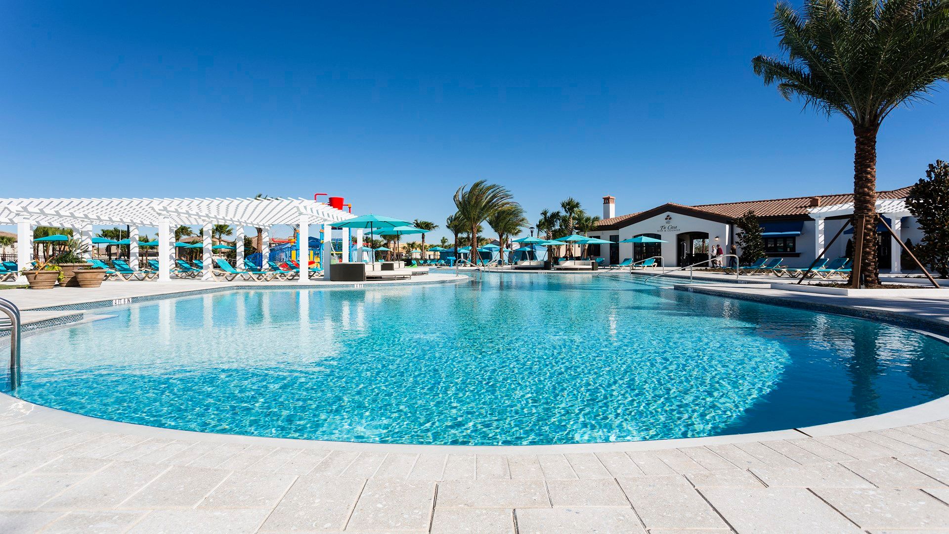 Resort-style pool with cabanas, sun loungers, and shaded areas—perfect for relaxation and fun.