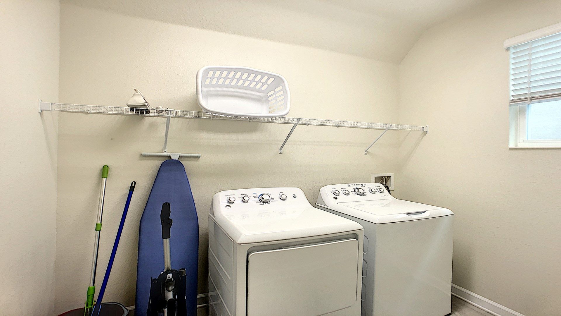 Convenient laundry room with a washer, dryer, and essentials for a hassle-free stay.