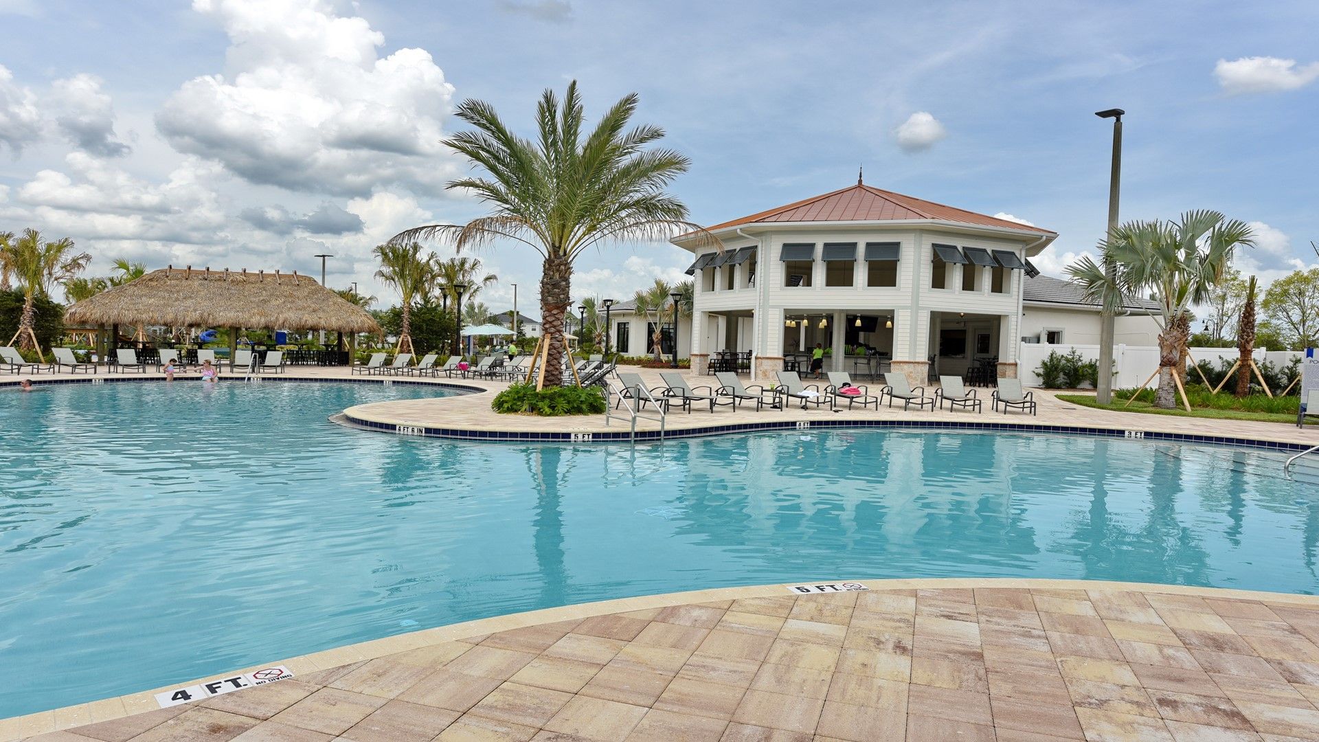 Enjoy sun-soaked days at the clubhouse pool with loungers, shade, and style