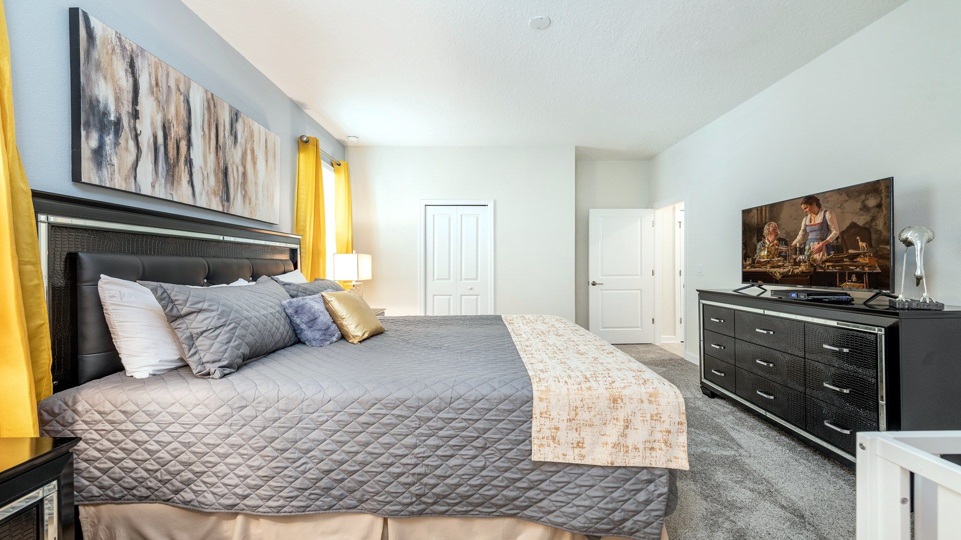 Cozy bedroom retreat with bold yellow accents and chic decor.
