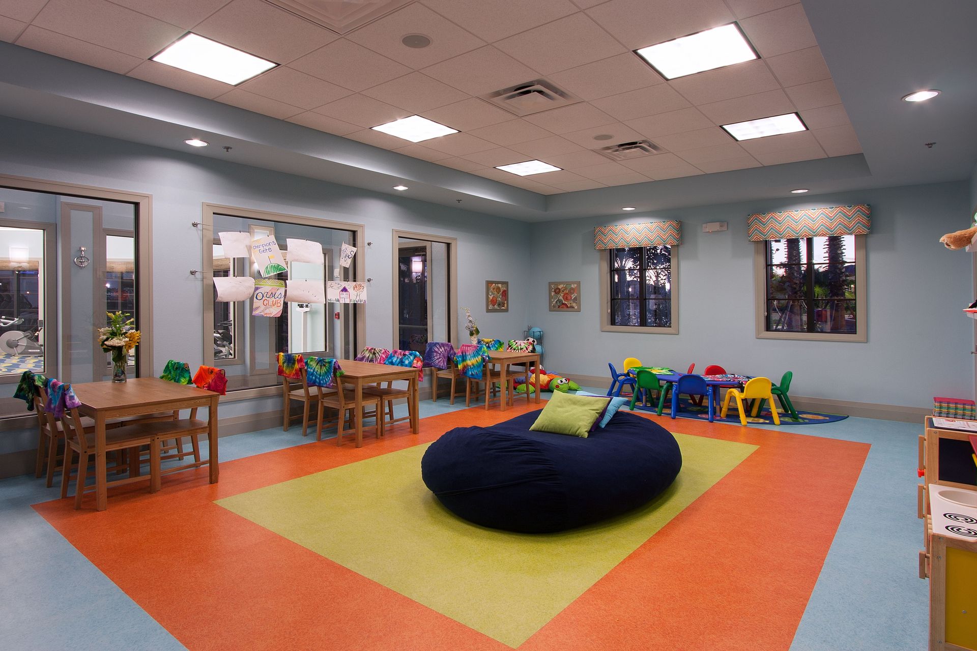 Resort's bright and cheerful children's playroom filled with toys and creative spaces!