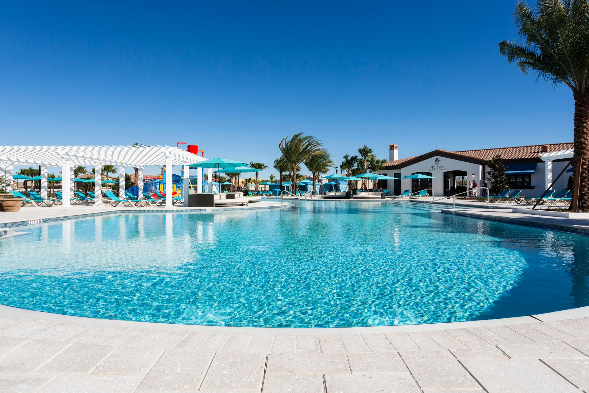 Resort-style pool with cabanas, sun loungers, and shaded areas—perfect for relaxation and fun.