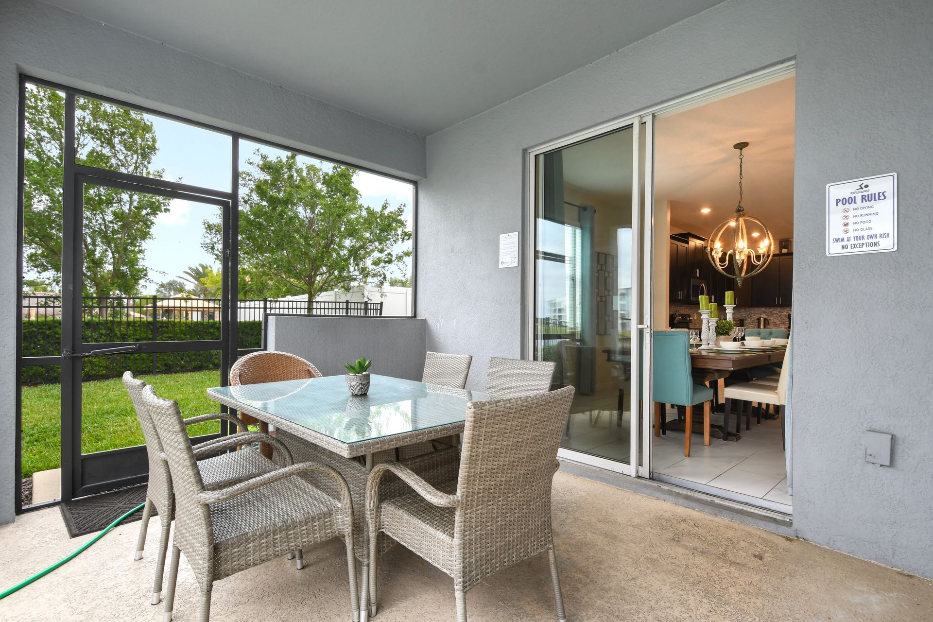 Dine al fresco on the covered patio with easy access to the kitchen inside.