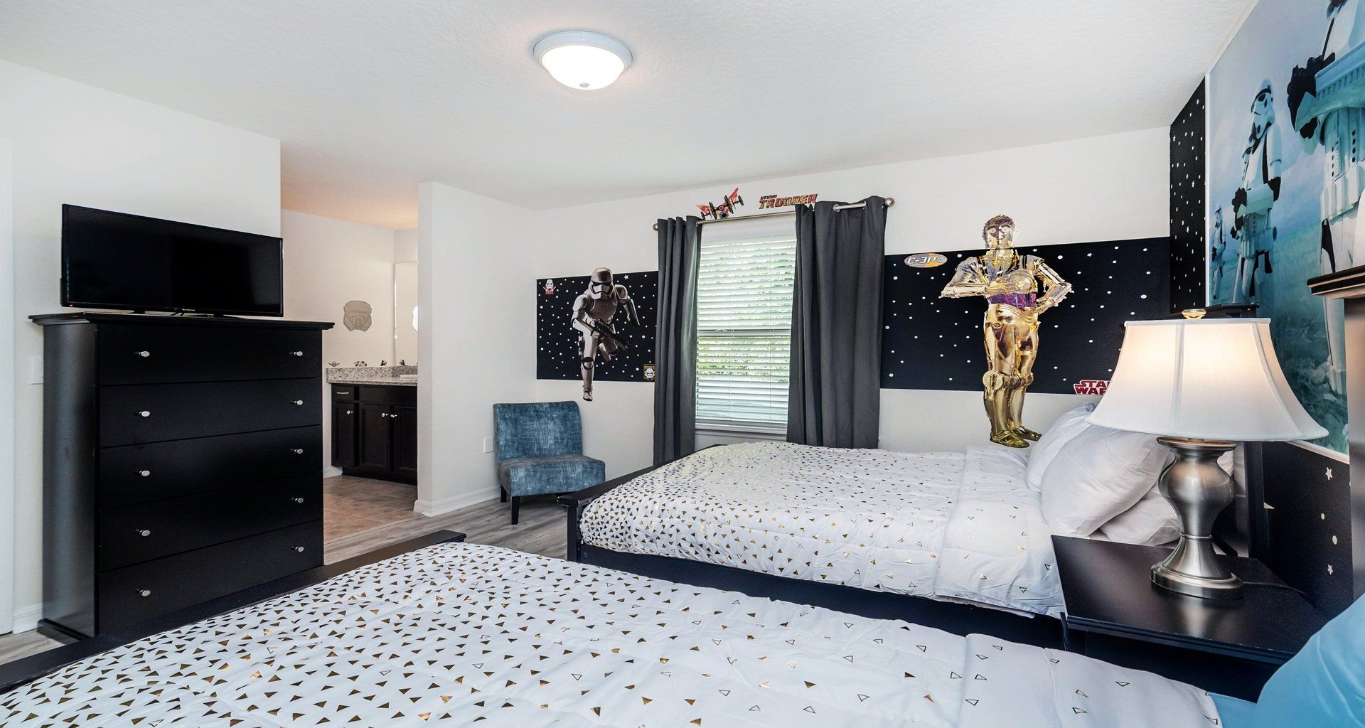 Galactic-themed bedroom with twin beds, perfect for young space adventurers.