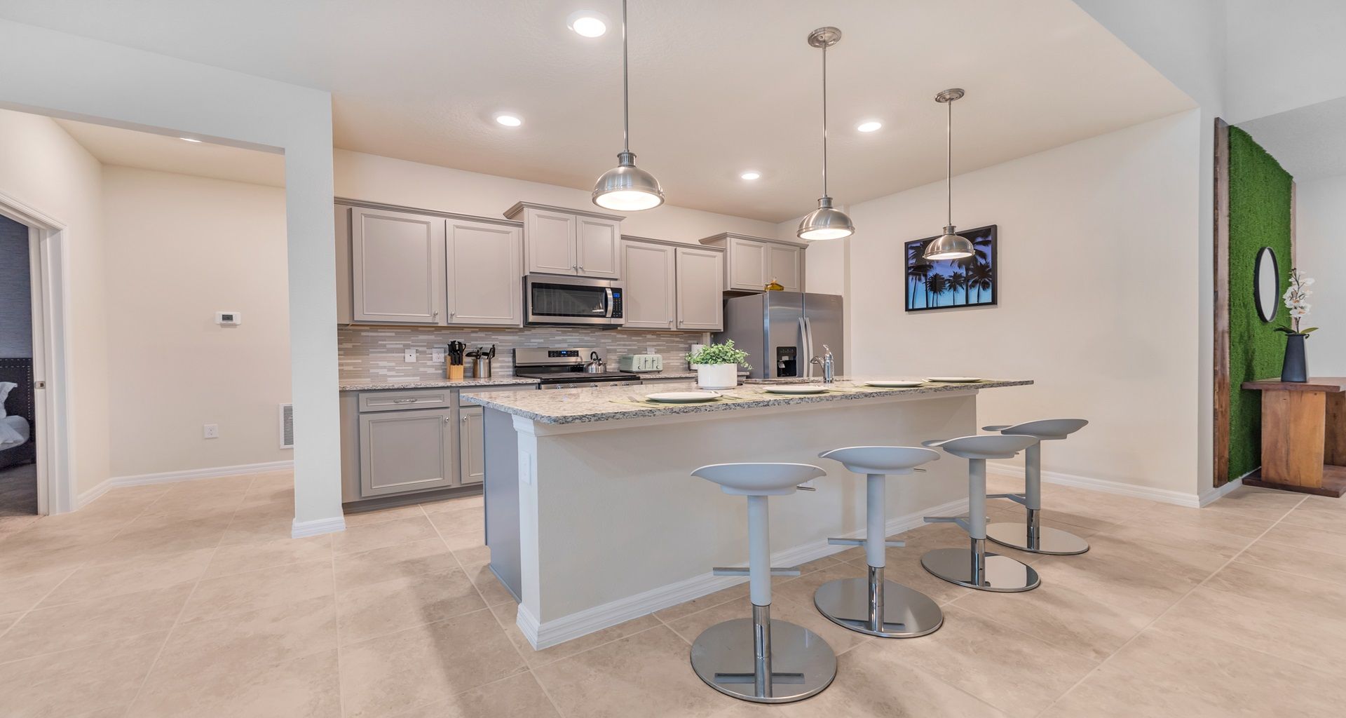 Modern kitchen seamlessly integrated with a sleek mini breakfast bar