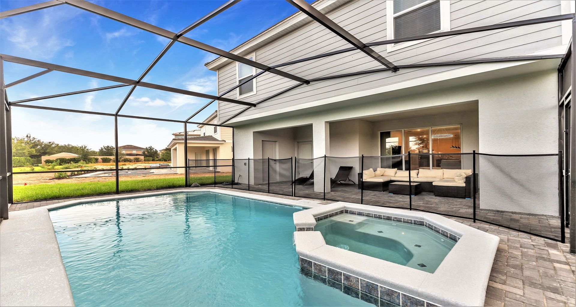 Refreshing outdoor pool, surrounded by vibrant greenery.