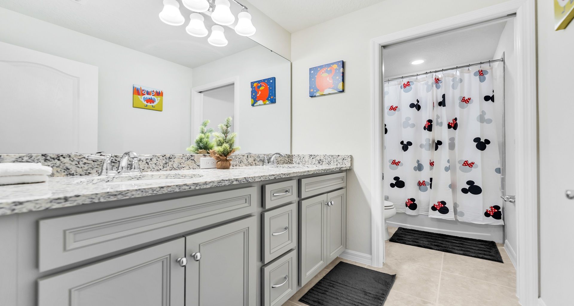 A spacious bathroom with a tasteful blend of functionality