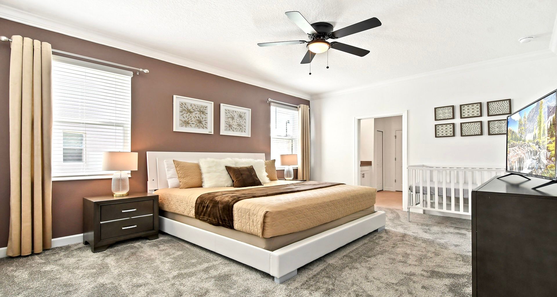 The master bedroom on the ground floor with a luxuriously large king bed.