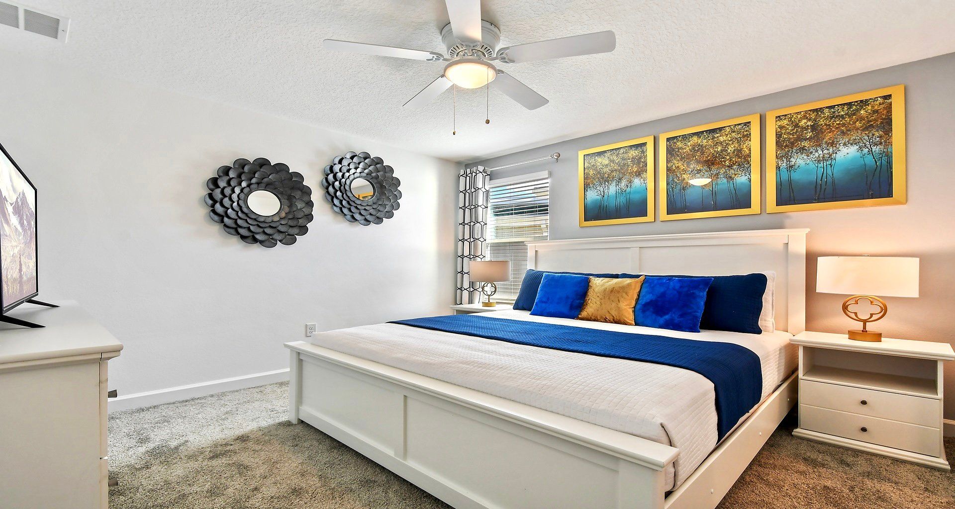 Indulge in royal comfort in the king bedroom, where a luxurious bed takes center stage, complemented by the convenience of a strategically placed TV.