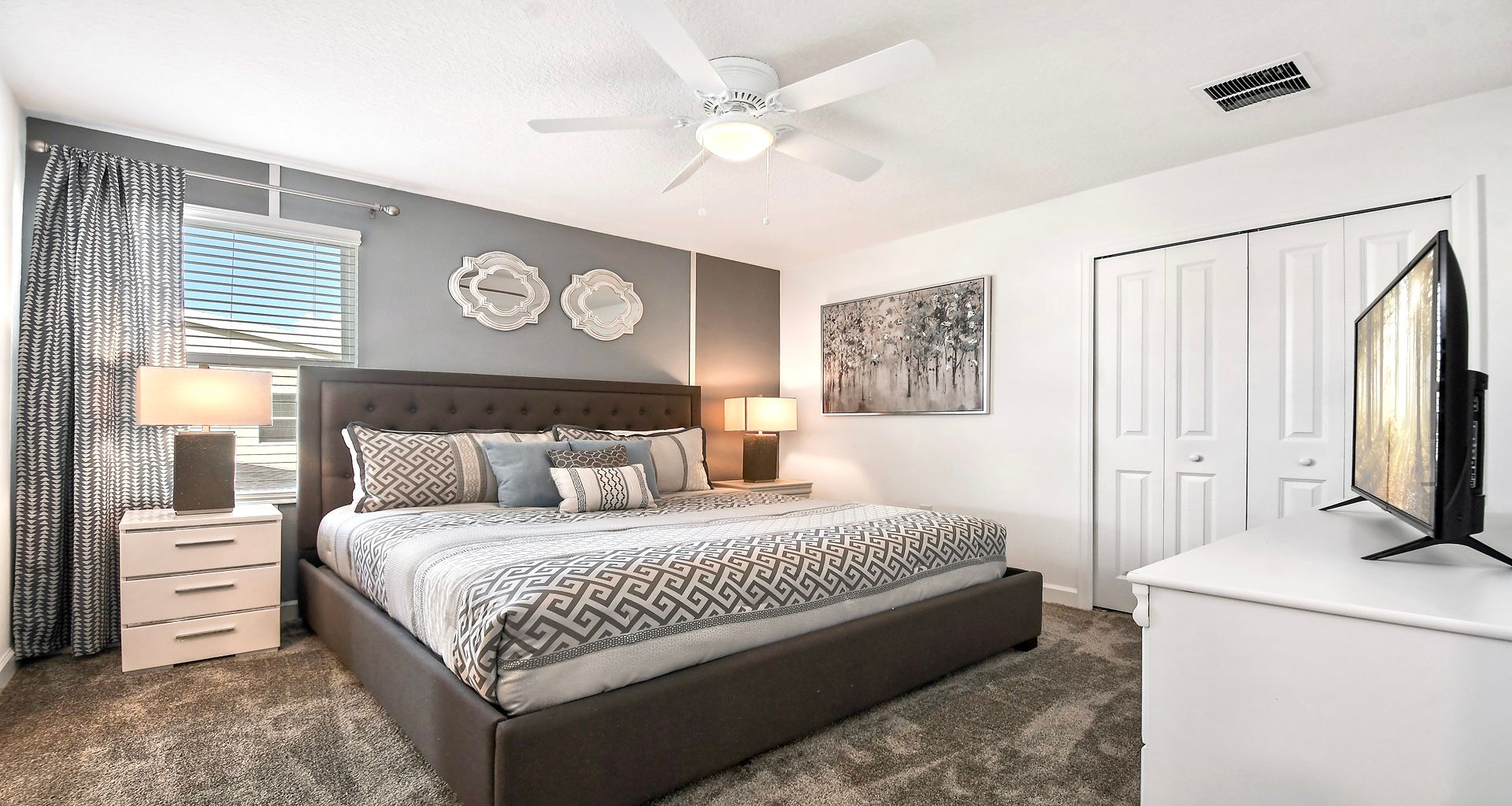 Indulge in royal comfort in the king bedroom, where a luxurious bed takes center stage, complemented by the convenience of a strategically placed TV.