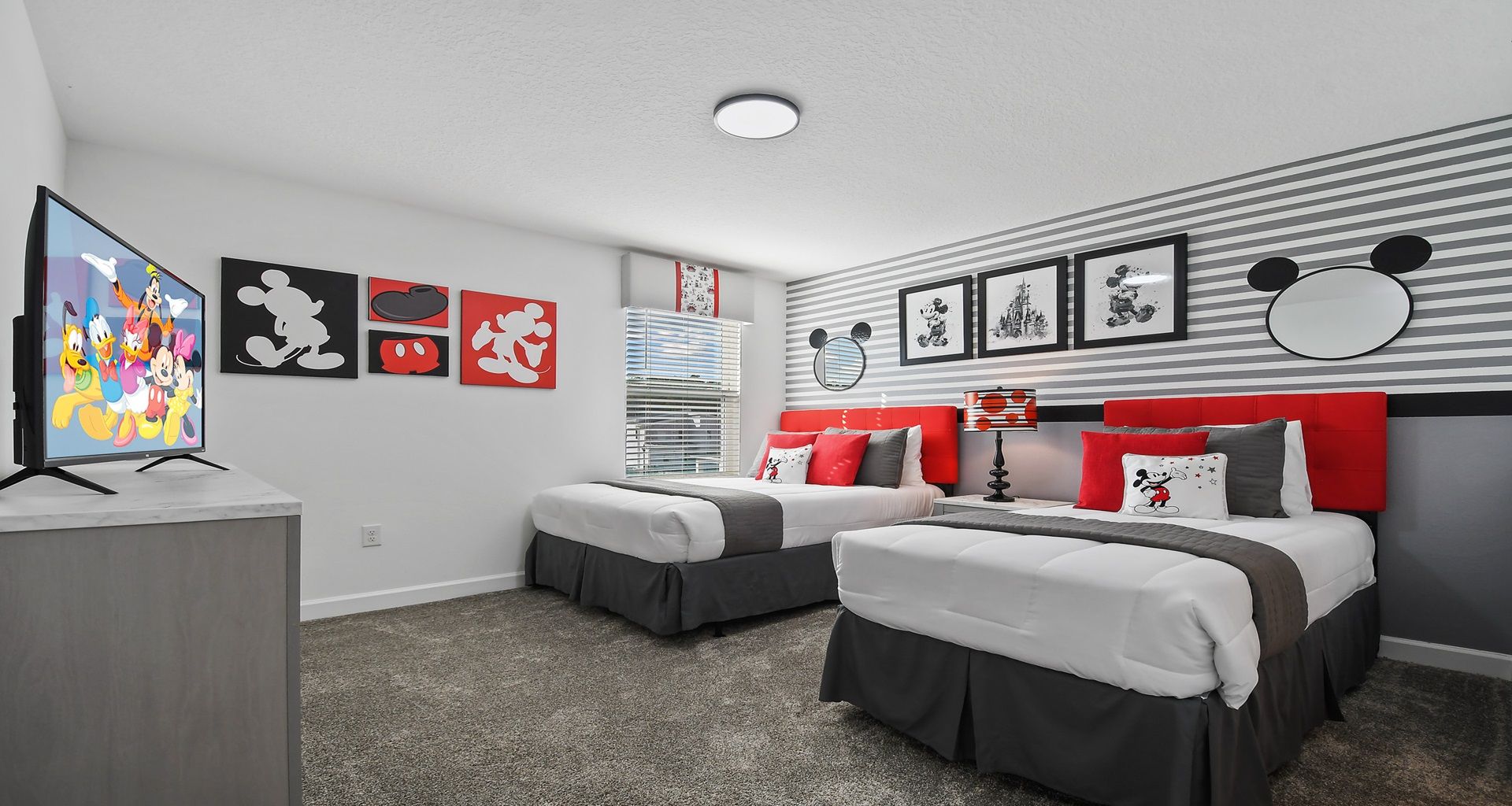 Experience the magic with a Mickey Mouse-themed bedroom, where iconic ears, vibrant colors, and playful decor bring the beloved Disney character to life.