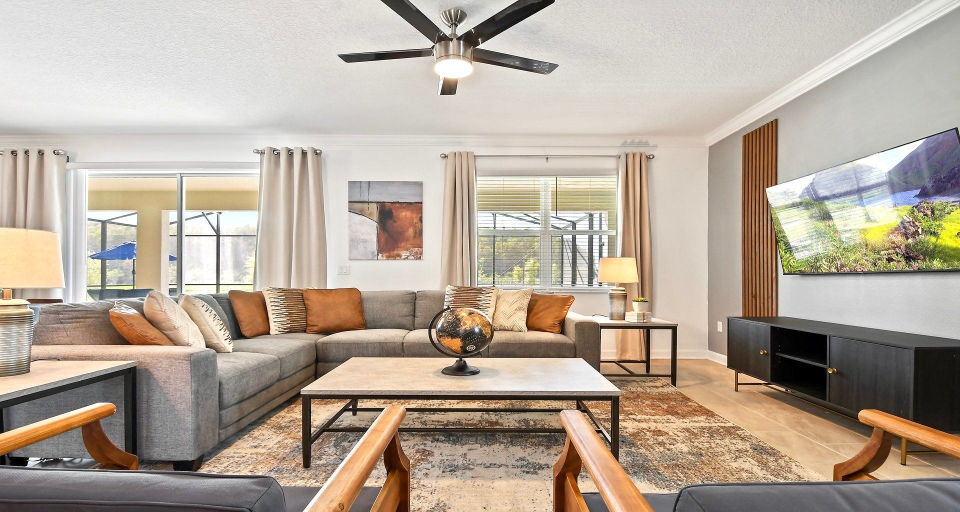 Generously sized living room featuring a cozy sofa, creating an inviting and comfortable space ideal for cherished family reunions and quality time together.