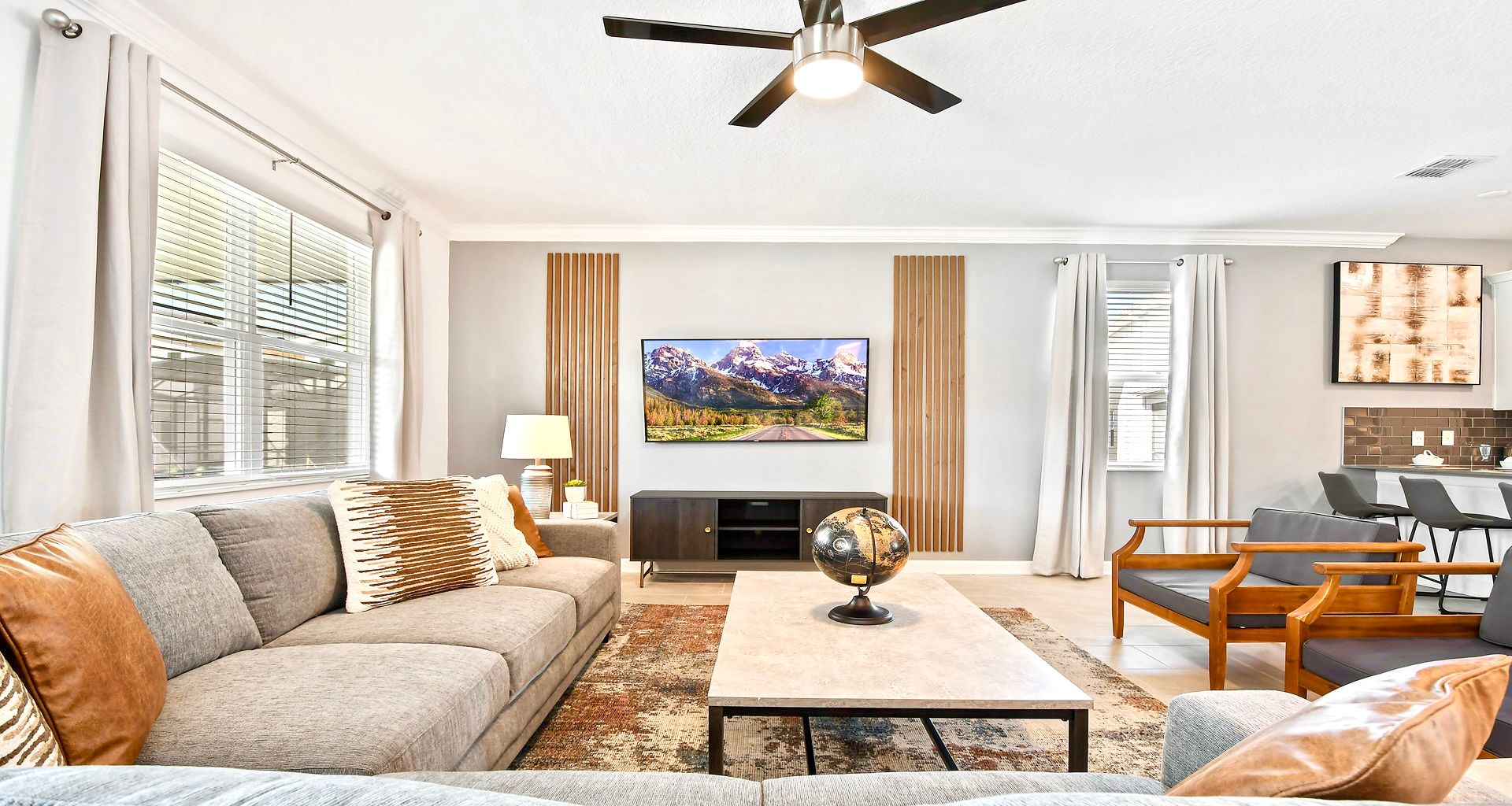 Generously sized living room featuring a cozy sofa, creating an inviting and comfortable space ideal for cherished family reunions and quality time together.