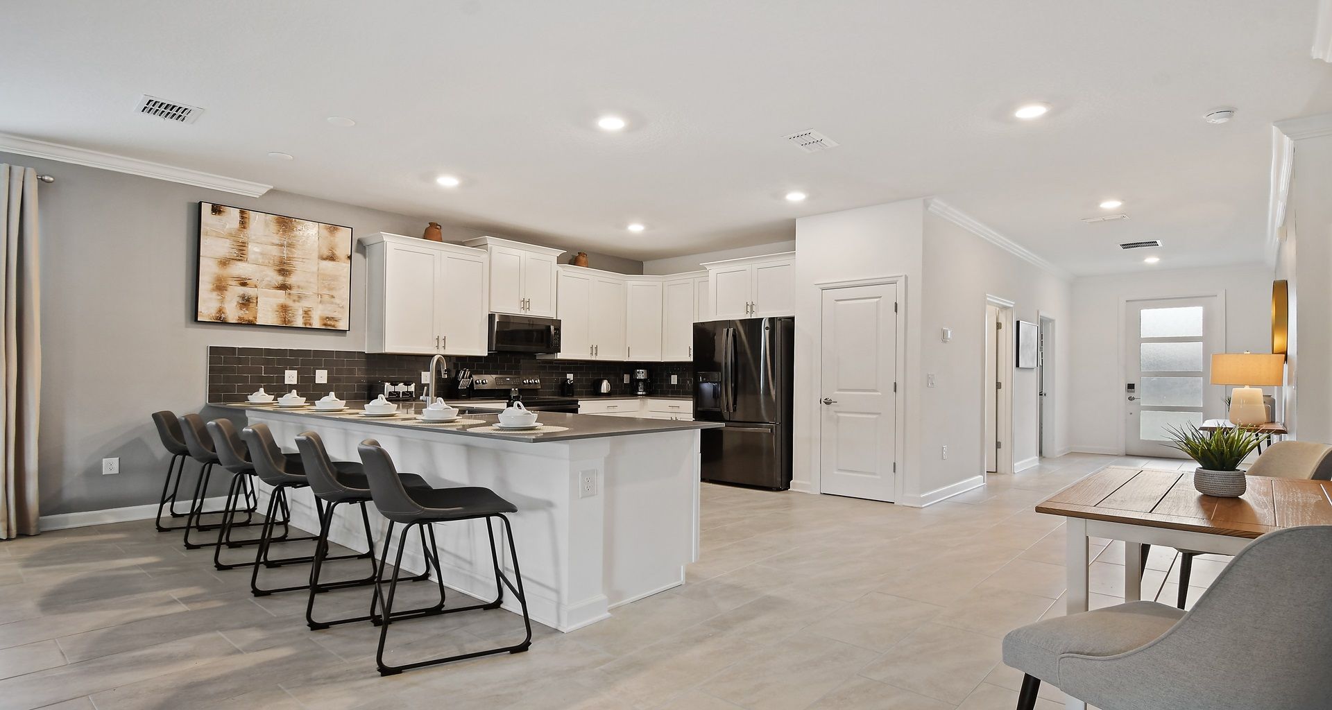 Kitchen featuring a convenient breakfast bar, offering a stylish and casual dining space.