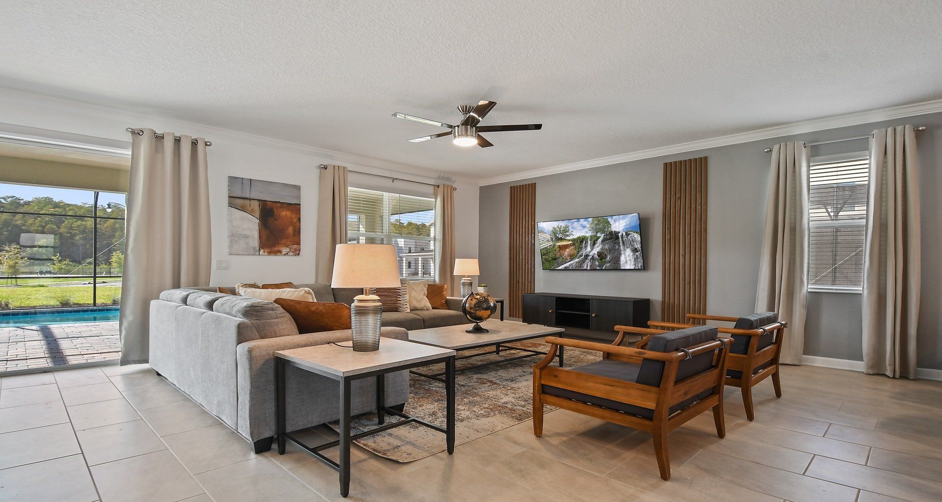 Generously sized living room featuring a cozy sofa, creating an inviting and comfortable space ideal for cherished family reunions and quality time together.