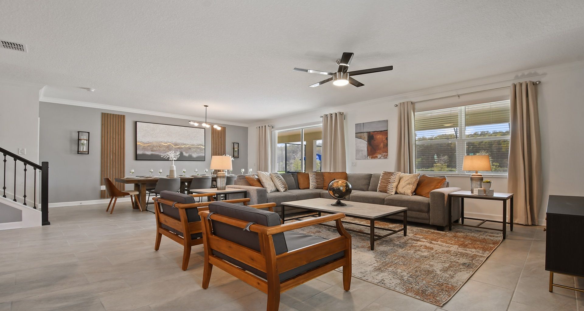 Generously sized living room featuring a cozy sofa, creating an inviting and comfortable space ideal for cherished family reunions and quality time together.