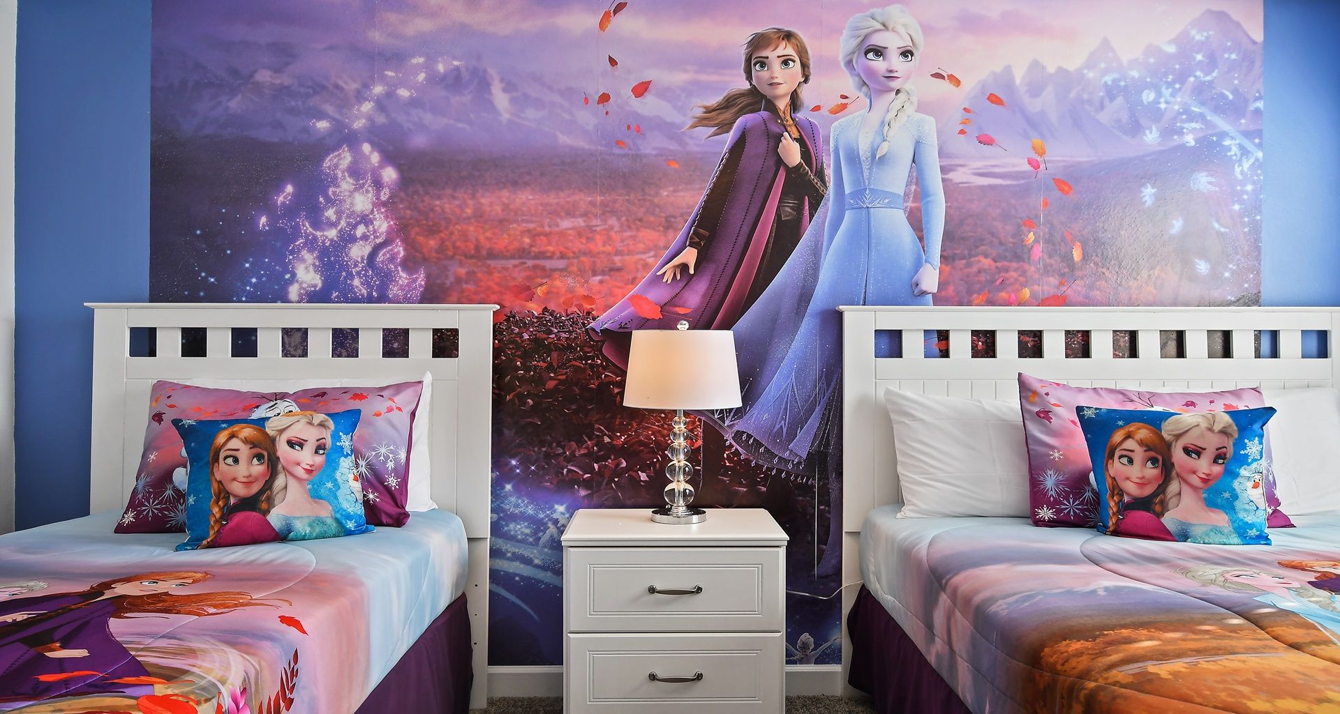 Immerse yourself in a Frozen-themed bedroom, where icy blues and enchanted decor transport the room into the magical world of Elsa and Anna.