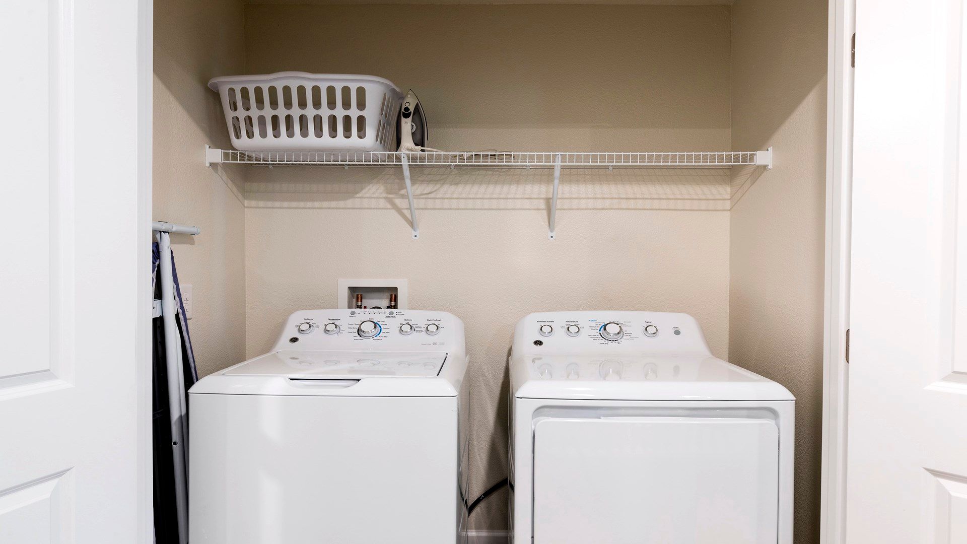 Dedicated laundry space equipped with a washer and dryer for convenient and efficient laundry tasks.