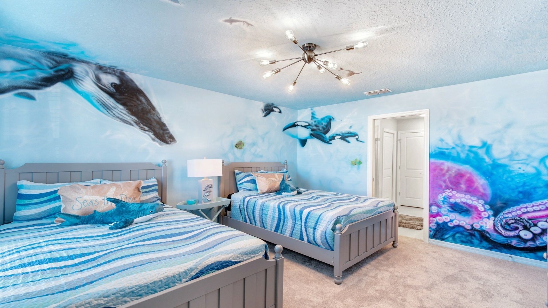 Ocean themed bedroom with 2 full sized beds.