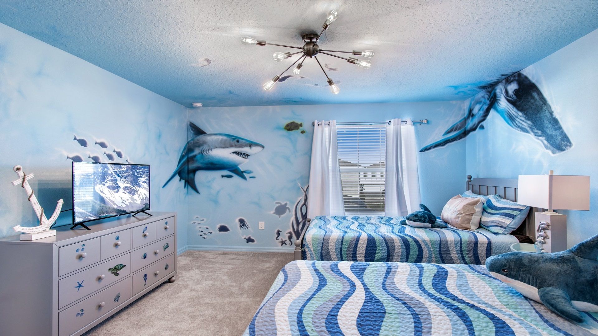 Ocean themed room includes flat screen TV