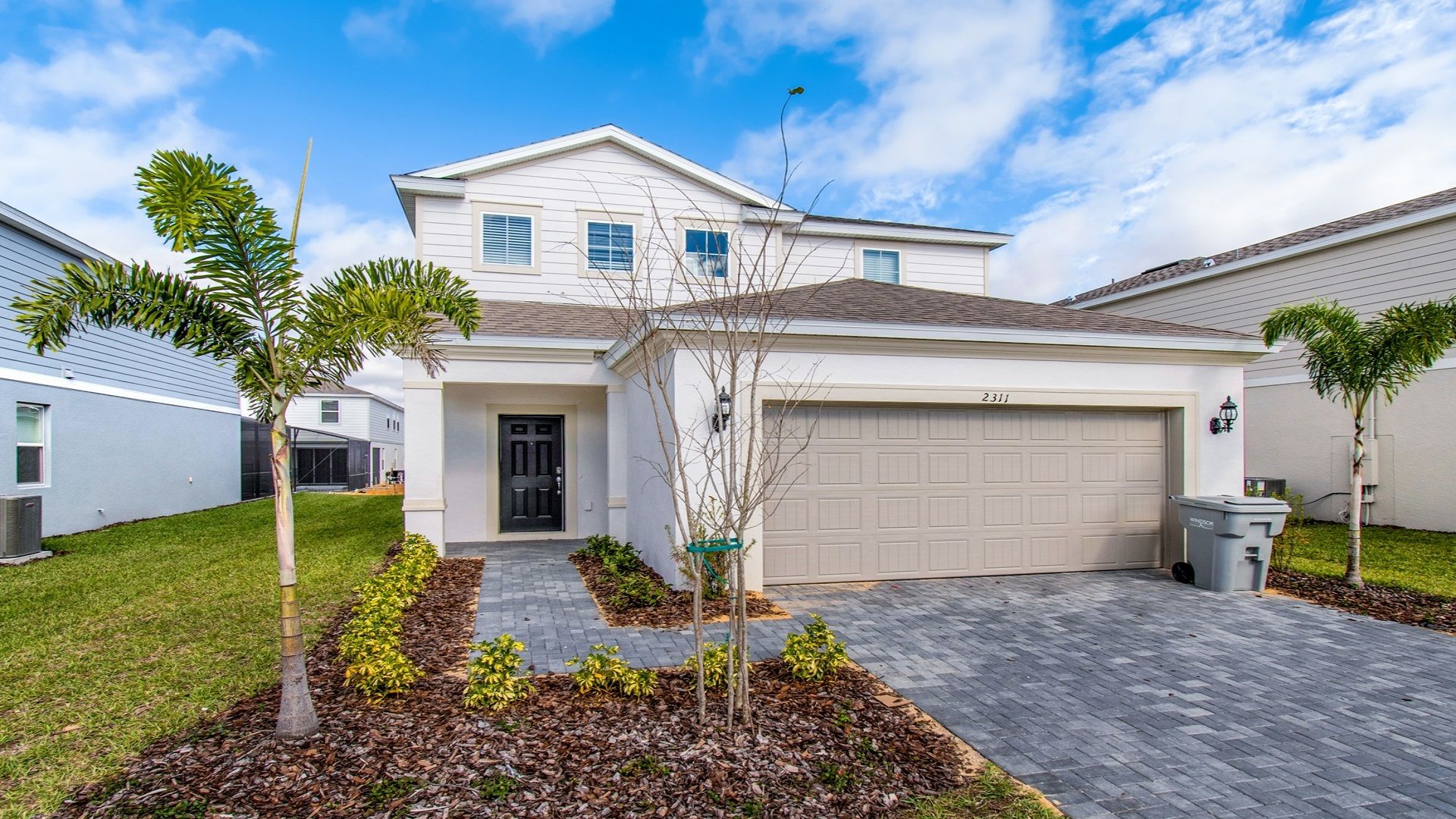 Home Exterior: Modern charm with a garage, creating a sleek and functional design.