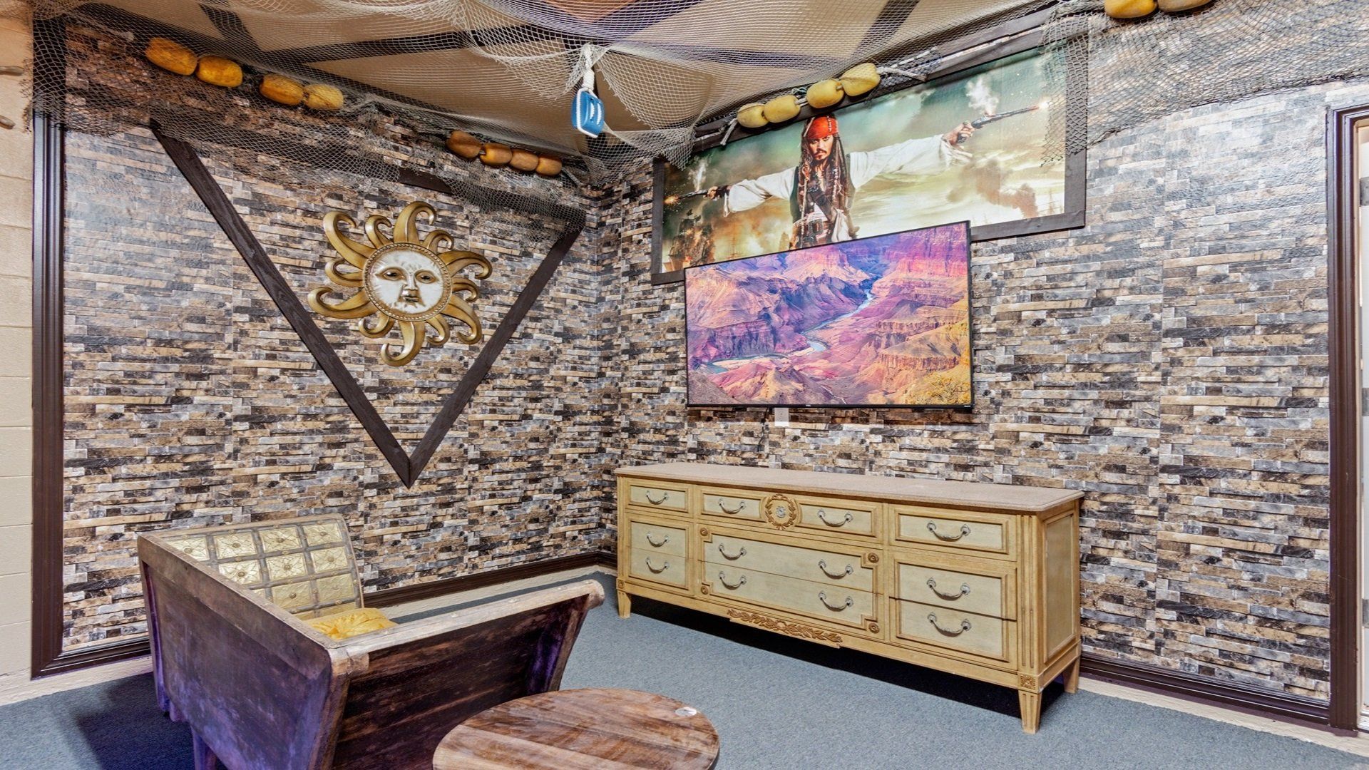 Pirates of the Caribbean themed room offers a large screen TV.