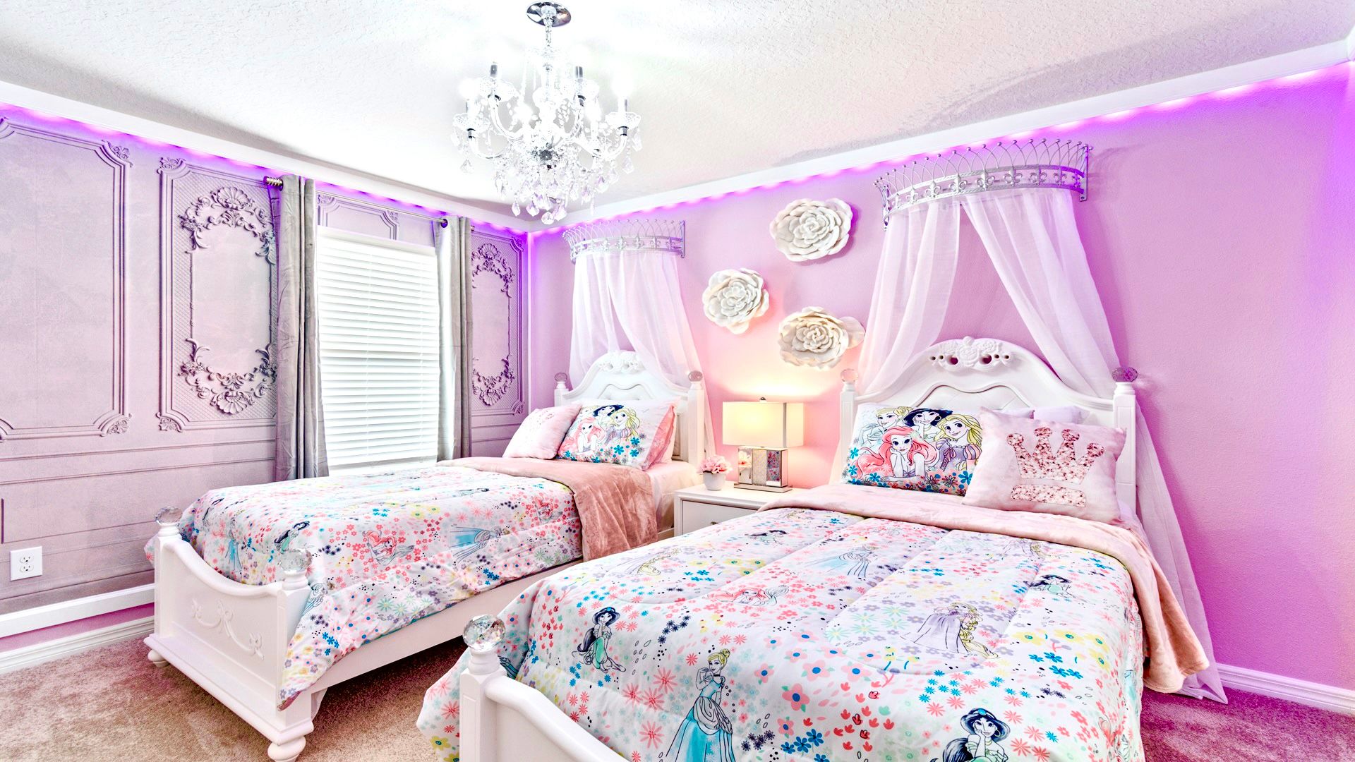 Princess themed bedroom including two twin sized beds.
