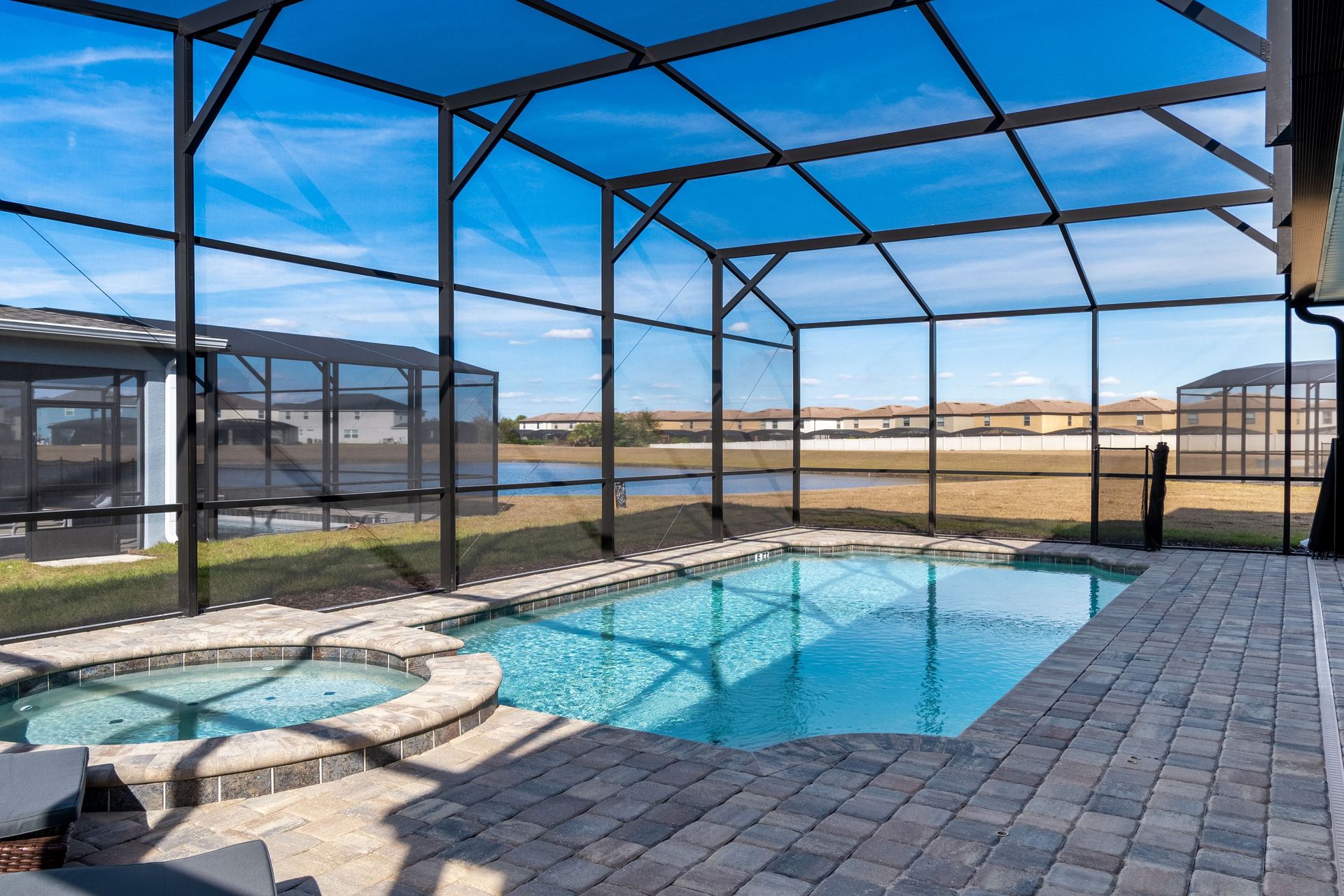 Private screened pool & spa with serene pond views—pure relaxation!