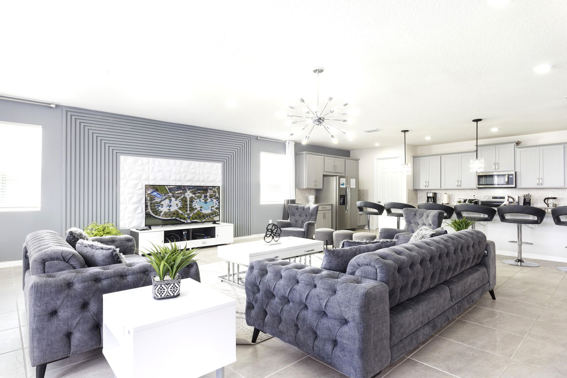 Spacious modern living area with sleek kitchen and chic decor!