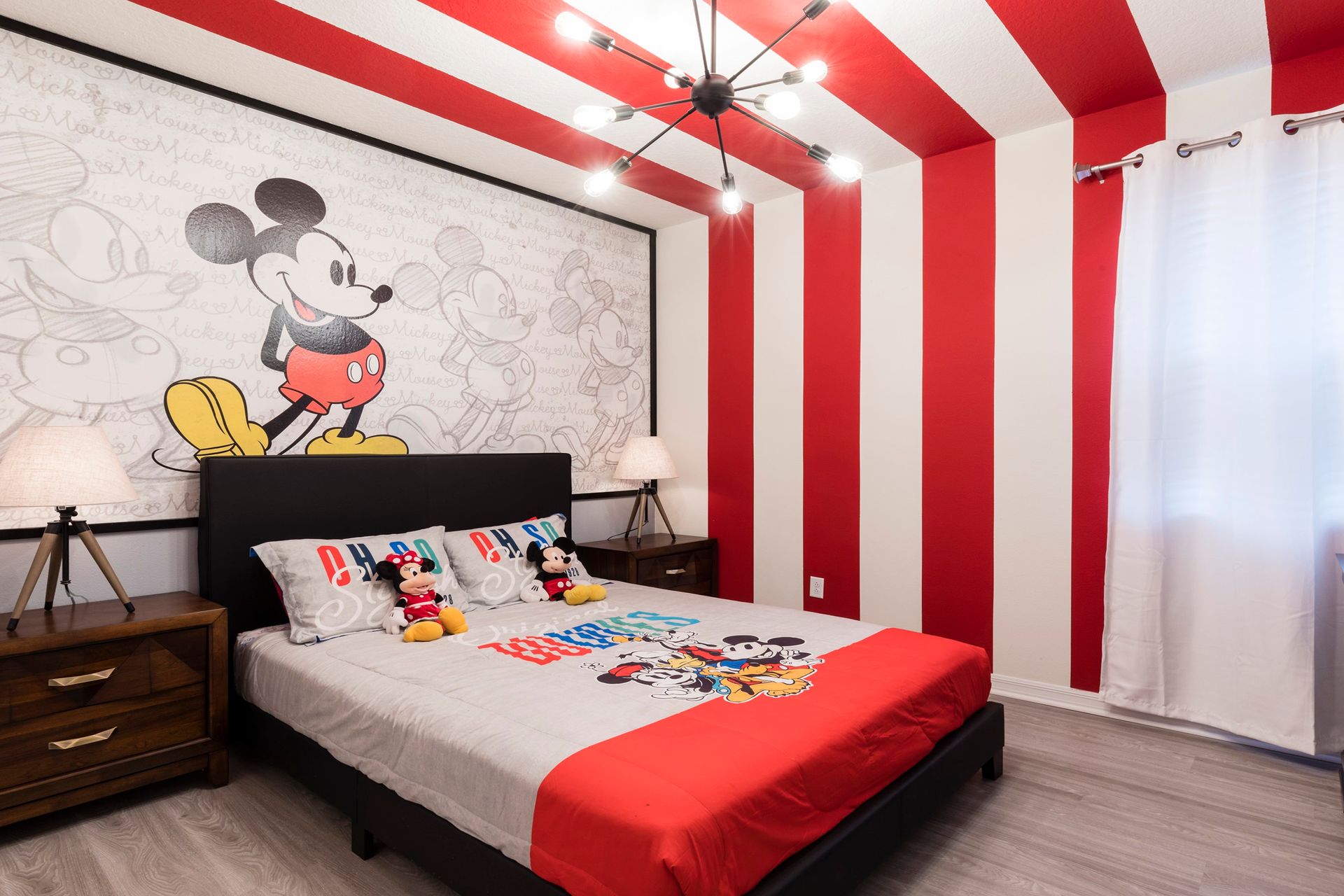 Cheerful Mickey Mouse-themed bedroom with bold stripes and fun decor!