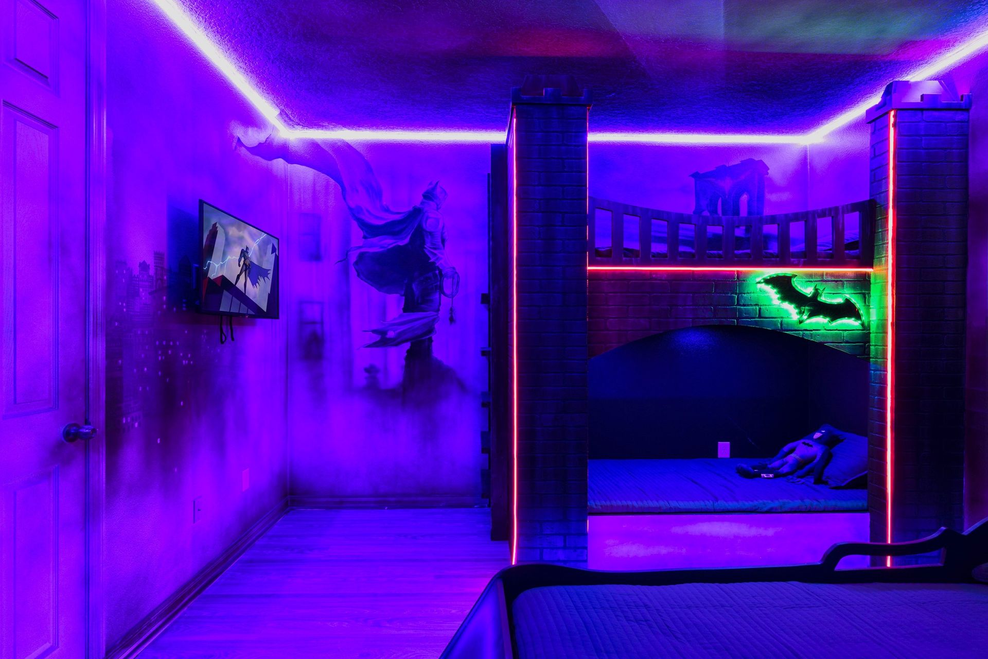 Gotham-themed bedroom with glowing neon accents and heroic vibes!