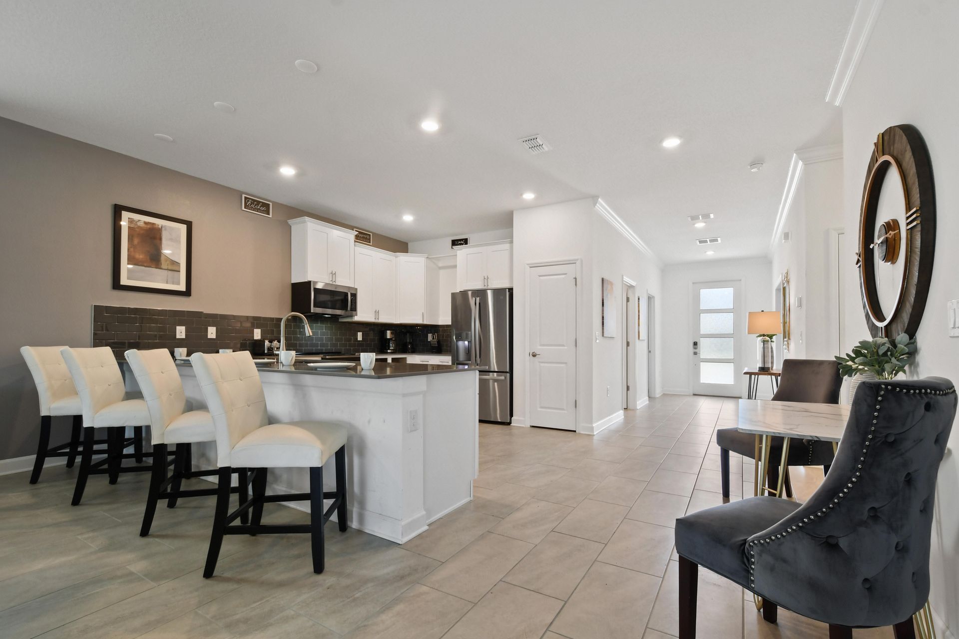 Modern kitchen with sleek finishes, bar seating, and an open layout for entertaining.