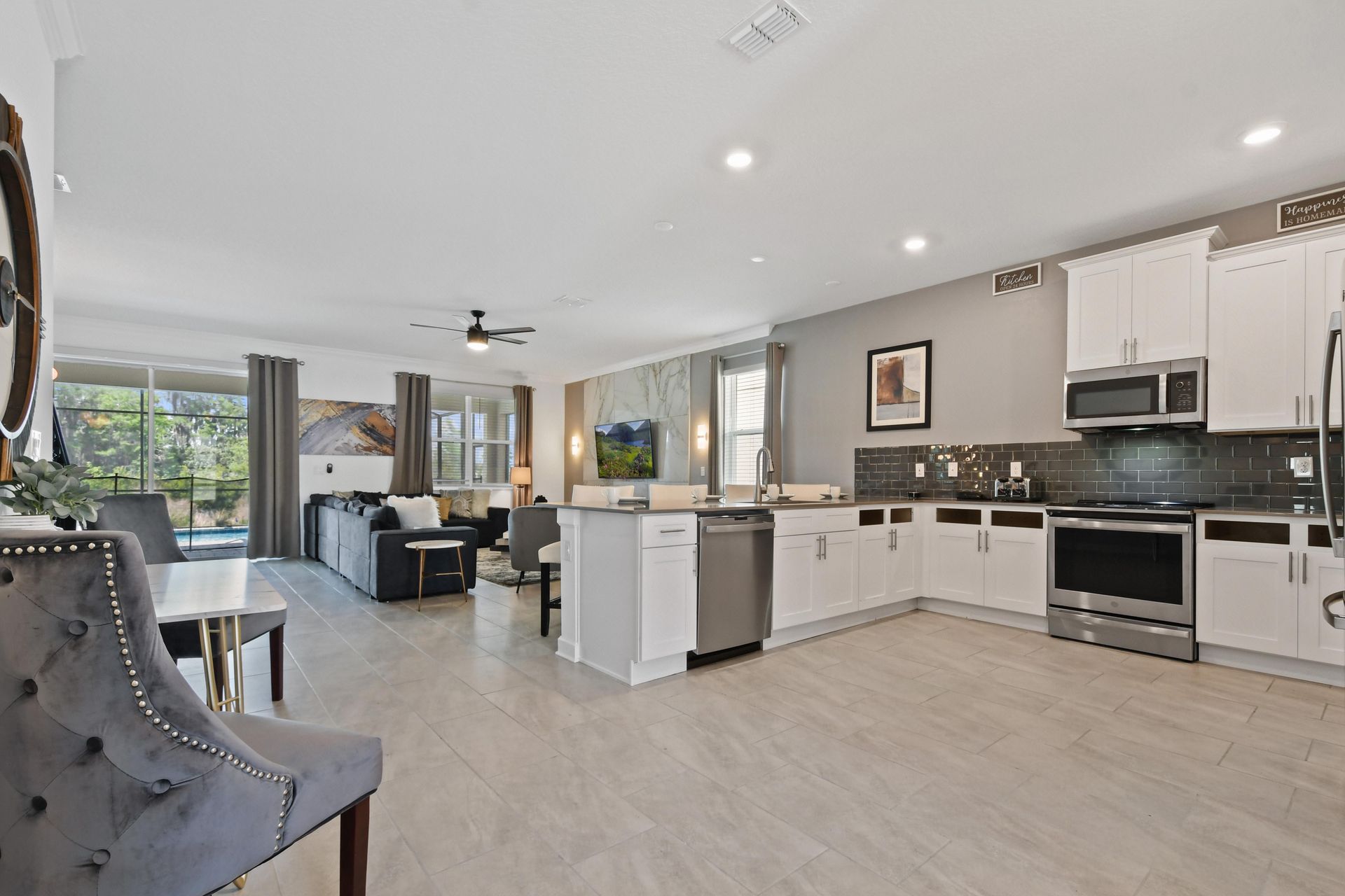 A seamless flow between the fully equipped kitchen and the living area makes this space ideal for entertaining, cooking, and connecting with loved ones.