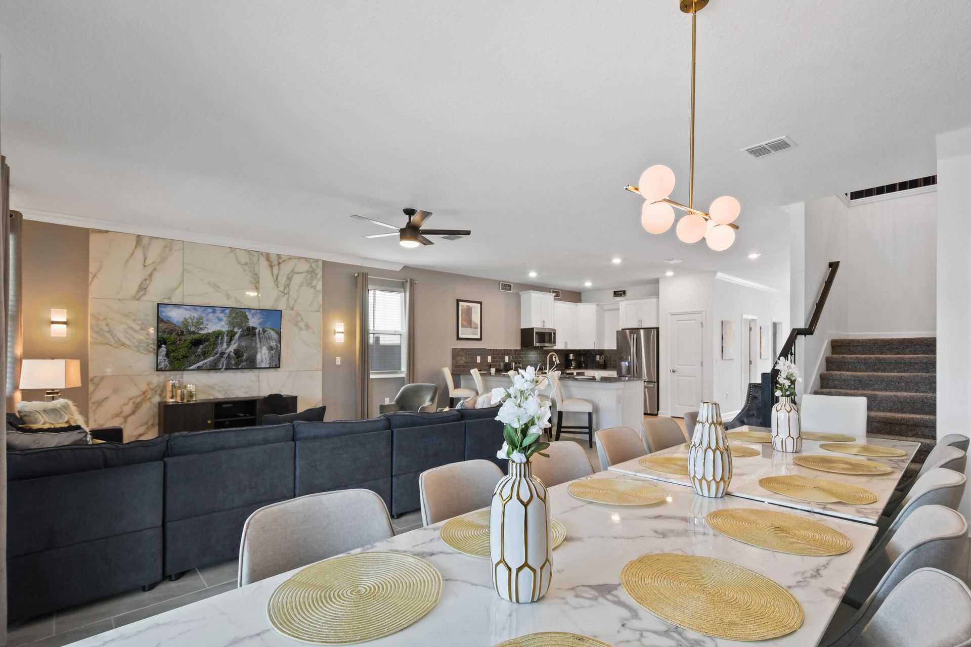Host elegant family dinners in this luxurious dining space with seating for all. Enjoy the modern design and beautiful views through the large sliding glass doors.