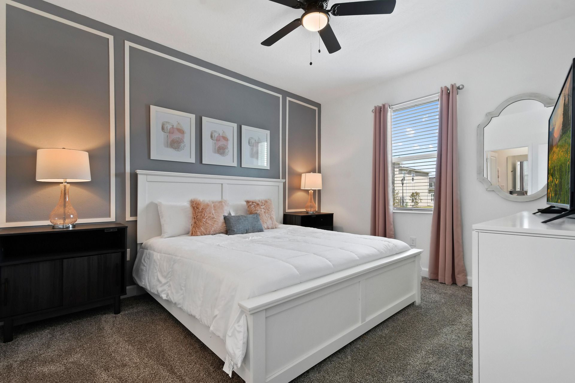 Elegant bedroom with a plush king bed, soft decor, and a calming modern design.
