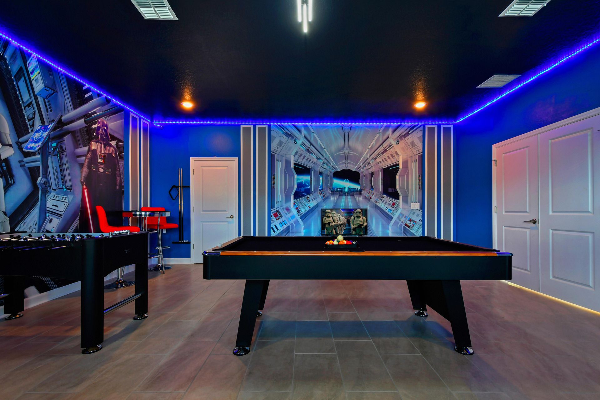 Epic space-themed game room with bunk beds, a pool table, and glowing LED lights.